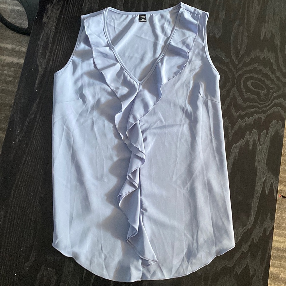 Light blue sleeveless blouse